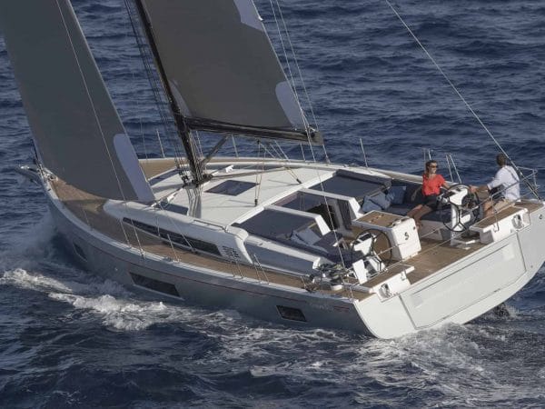 Couple enojying the Beneteau Oceanis 51.1 while crusing through the waves